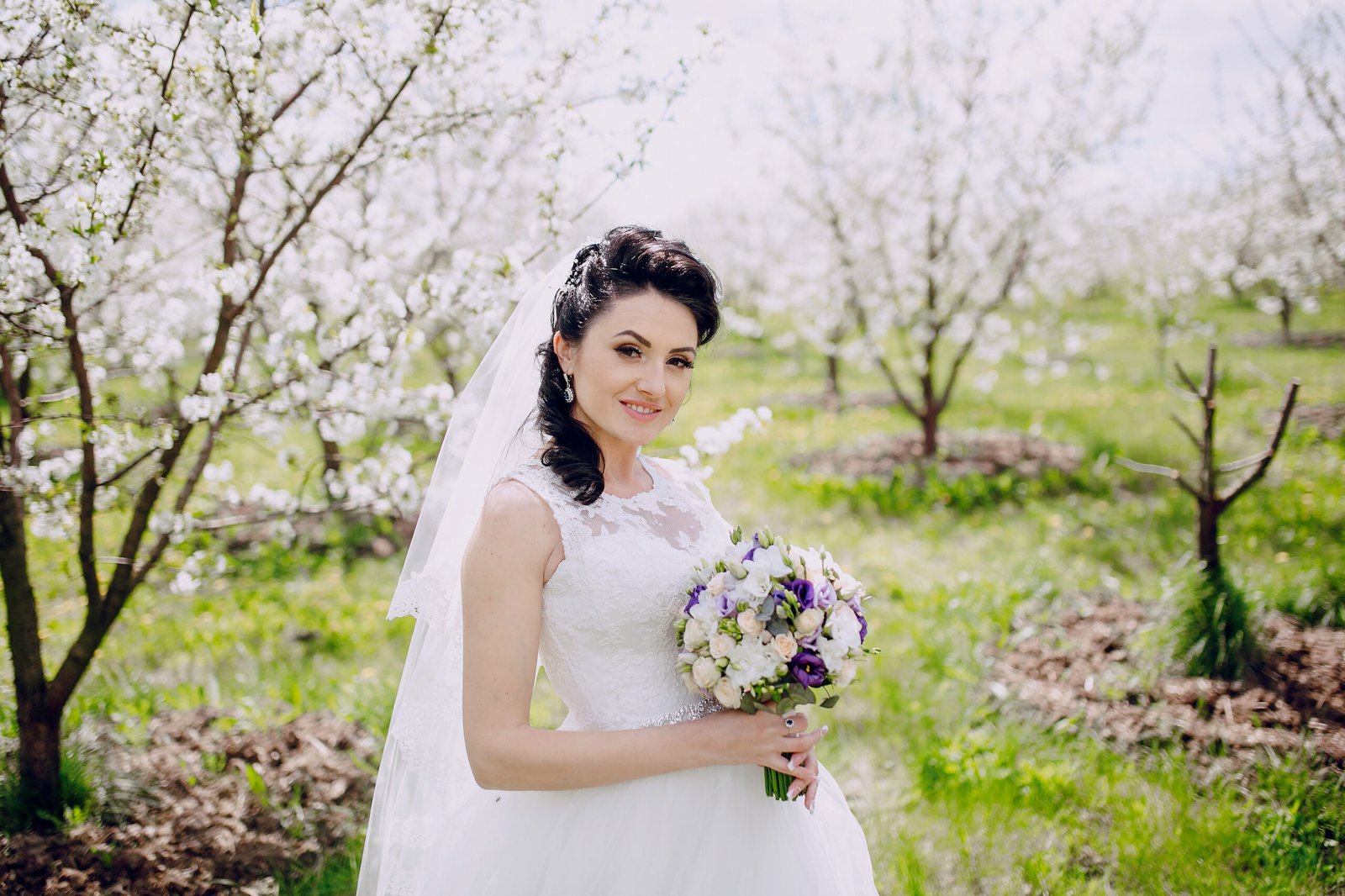 Wedding couple near cherry blossom